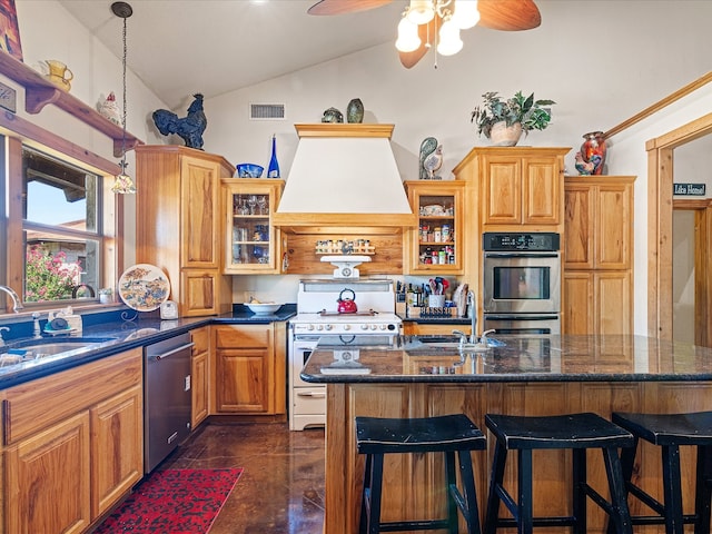 kitchen featuring custom exhaust hood, lofted ceiling, sink, a kitchen island, and appliances with stainless steel finishes