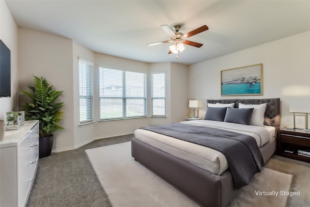 bedroom with ceiling fan and carpet