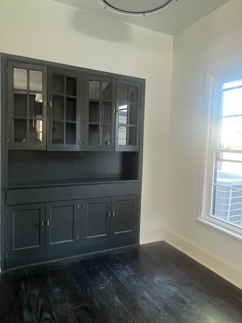 unfurnished dining area with dark hardwood / wood-style floors