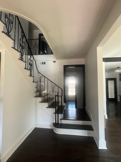 stairway featuring hardwood / wood-style flooring