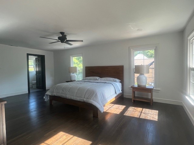 bedroom featuring ceiling fan and dark wood-type flooring