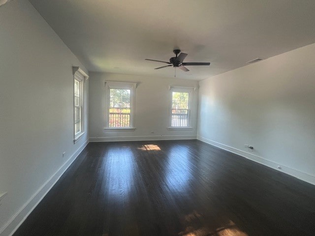 unfurnished room featuring ceiling fan and dark hardwood / wood-style floors