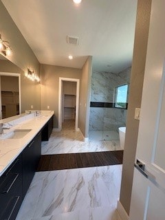 bathroom featuring tile floors and dual bowl vanity