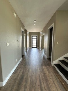 hallway with dark hardwood / wood-style floors