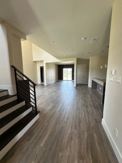 unfurnished living room with dark hardwood / wood-style floors