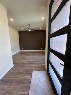 foyer featuring dark hardwood / wood-style flooring and ceiling fan