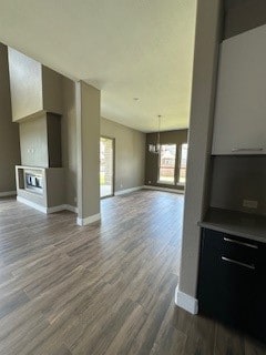 living room featuring a wealth of natural light and hardwood / wood-style floors