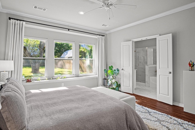 bedroom with ceiling fan, dark wood-type flooring, ensuite bathroom, and crown molding