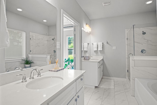 bathroom featuring independent shower and bath and vanity