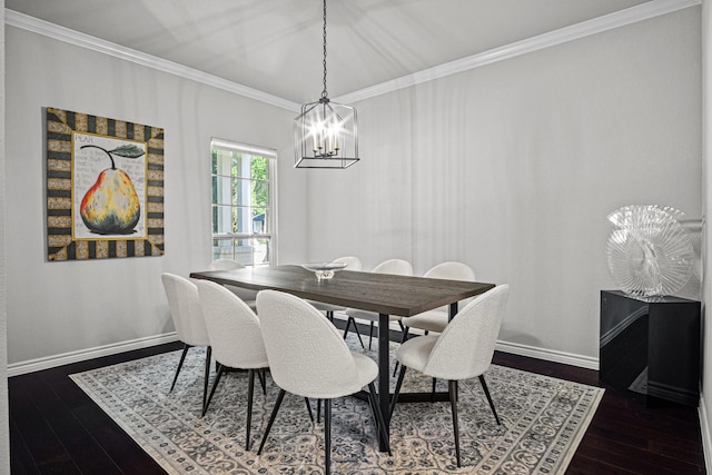 dining space featuring dark hardwood / wood-style flooring, a chandelier, and ornamental molding