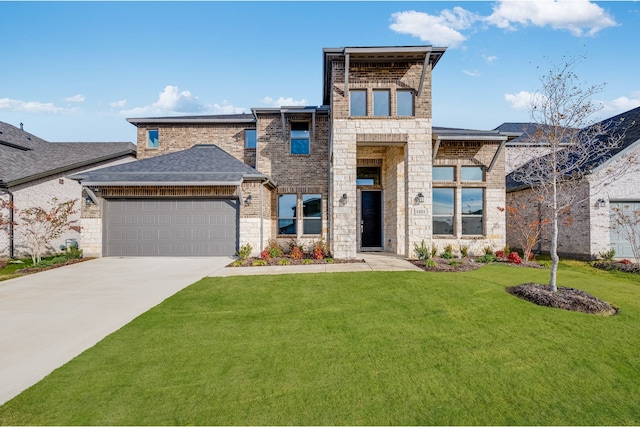 view of front of home featuring a front lawn and a garage