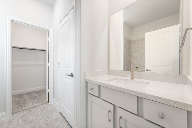 bathroom featuring tile patterned flooring and vanity