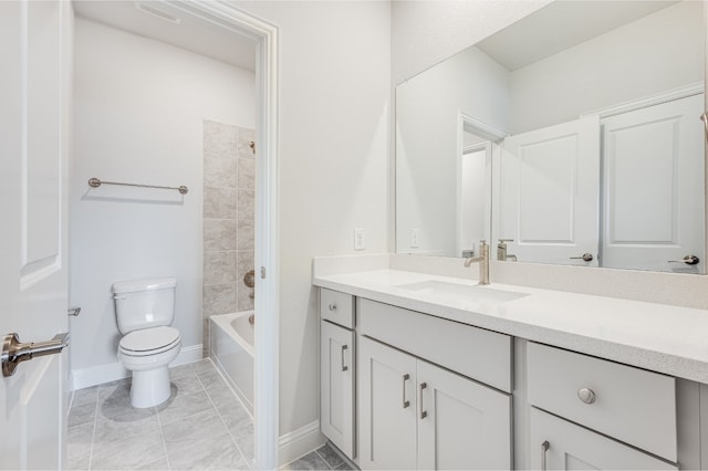 full bathroom with vanity, tile patterned flooring, tiled shower / bath, and toilet