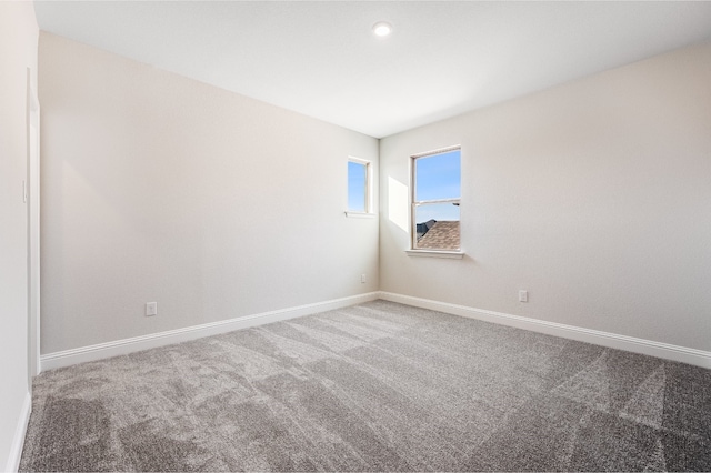 unfurnished room with carpet flooring