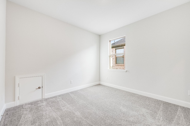 unfurnished room featuring carpet