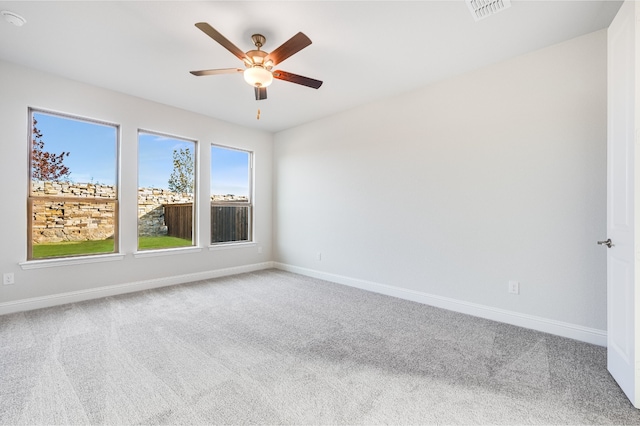 carpeted empty room with ceiling fan