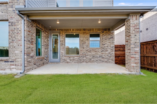 exterior space featuring a lawn and a patio