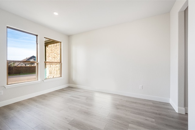 spare room with light hardwood / wood-style floors