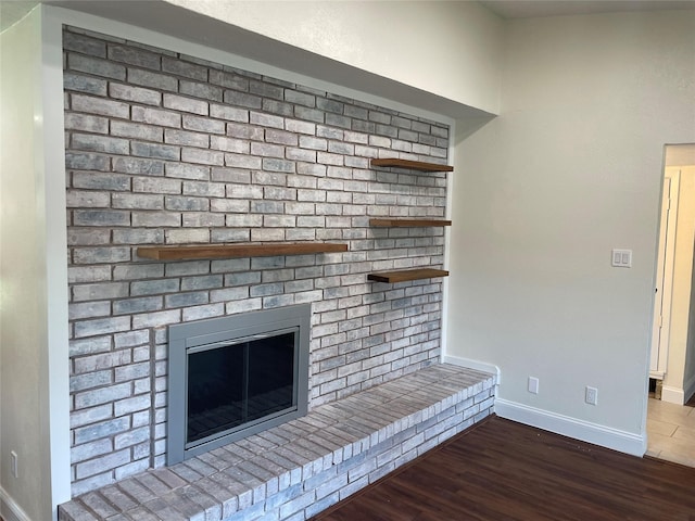 details featuring a fireplace and hardwood / wood-style floors