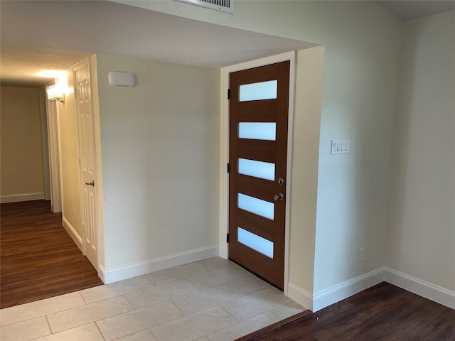 entrance foyer featuring light tile patterned flooring