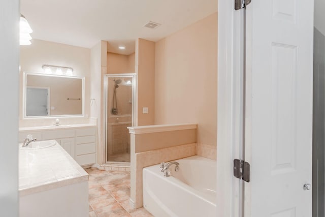 bathroom featuring a garden tub, vanity, visible vents, a shower stall, and tile patterned floors