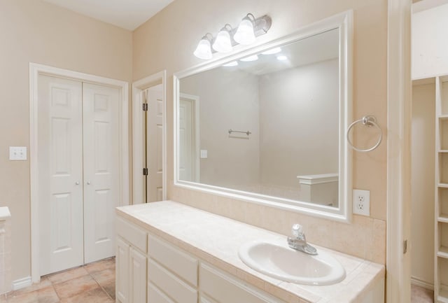 bathroom featuring tile patterned floors and vanity