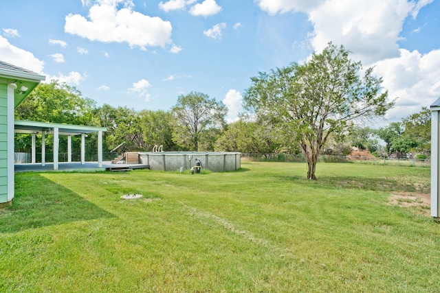 view of yard with an outdoor pool