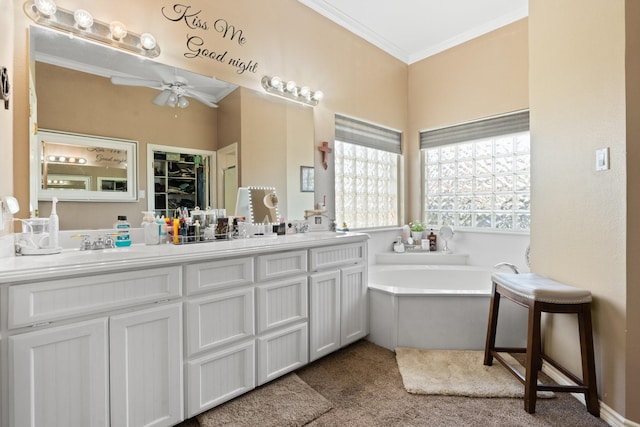 bathroom with a bath, vanity, ceiling fan, and ornamental molding