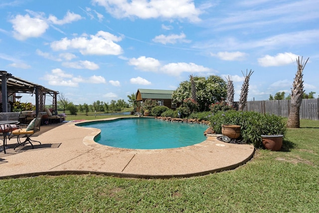 view of pool featuring a patio area and a yard