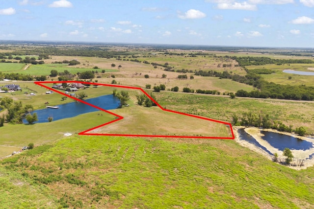 aerial view featuring a rural view and a water view