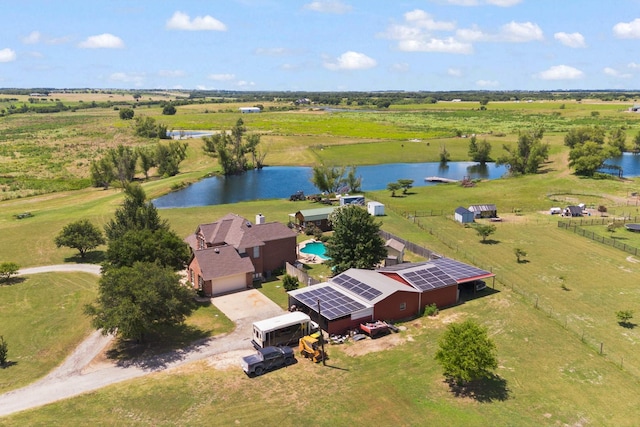 birds eye view of property with a rural view and a water view