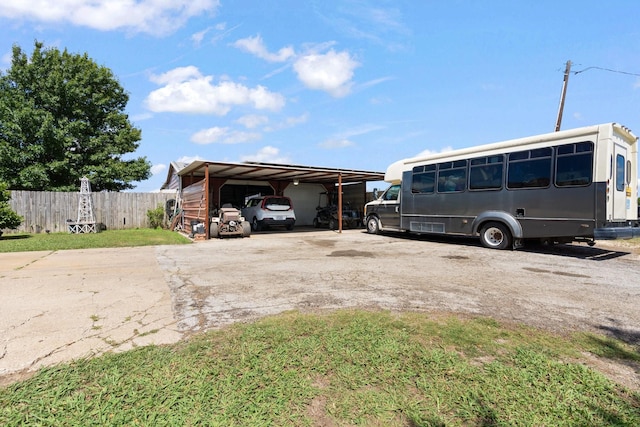 view of parking / parking lot with a carport