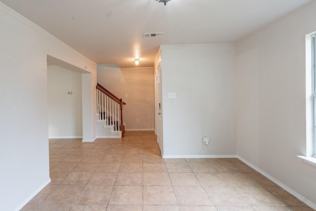 tiled empty room with ornamental molding