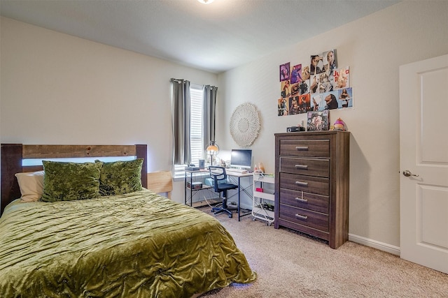 bedroom featuring light carpet