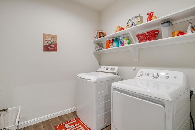 laundry room with dark hardwood / wood-style flooring and washer and clothes dryer