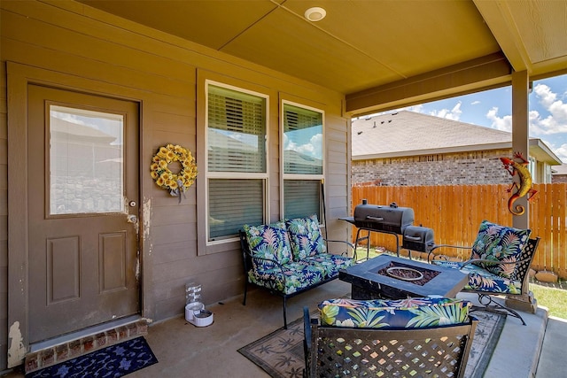 view of patio / terrace with an outdoor fire pit