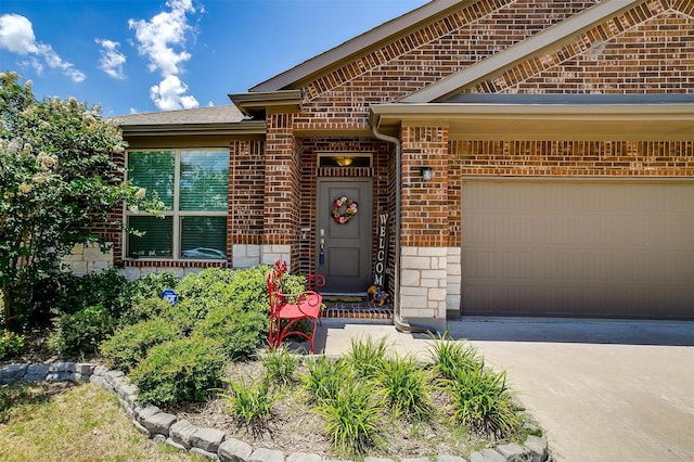 view of exterior entry with a garage