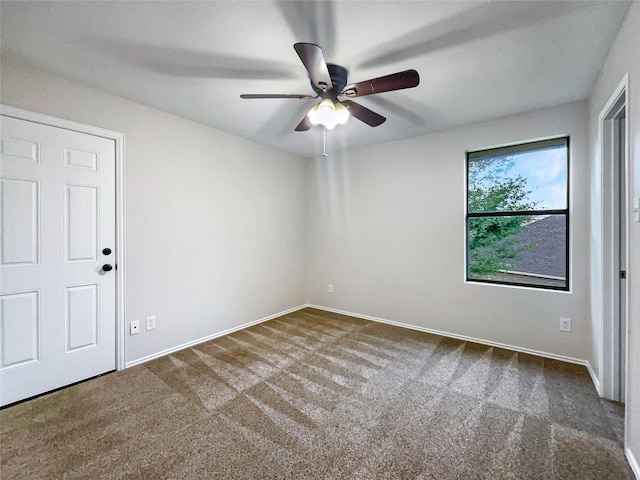 unfurnished room featuring ceiling fan and carpet flooring