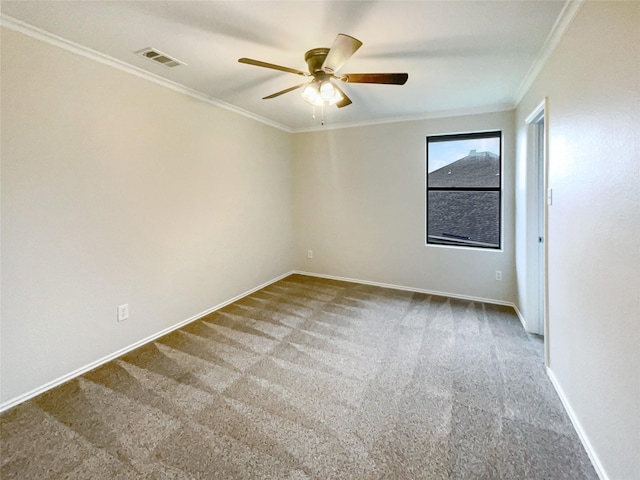 carpeted spare room featuring crown molding and ceiling fan