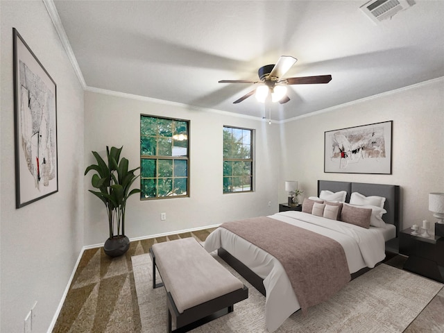 bedroom featuring ornamental molding and ceiling fan