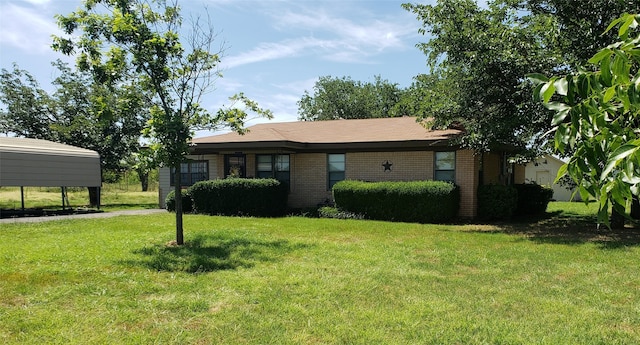 ranch-style home featuring a front yard