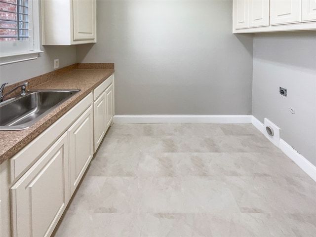 interior space featuring sink and white cabinets