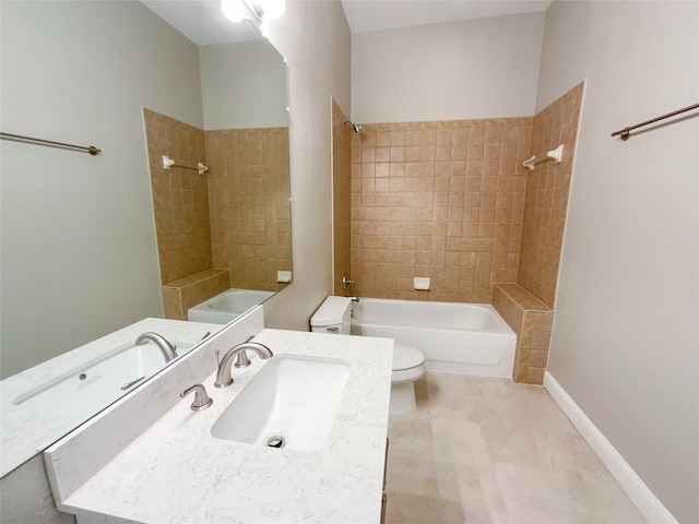 full bathroom featuring tiled shower / bath combo, tile patterned flooring, vanity, and toilet