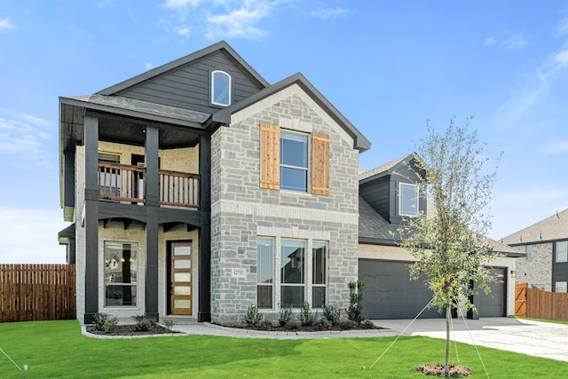 view of front of home with a balcony, a front lawn, and a garage