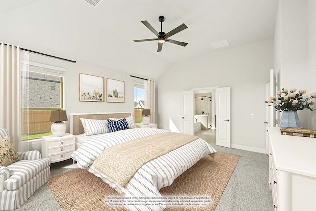 bedroom with ceiling fan, light colored carpet, connected bathroom, and vaulted ceiling