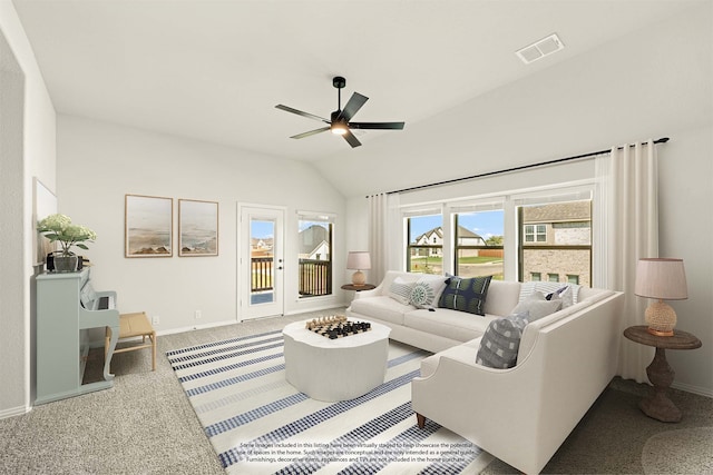 living room featuring ceiling fan, carpet flooring, and vaulted ceiling