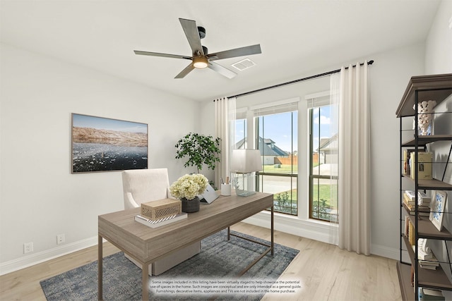 office space featuring light wood-type flooring and ceiling fan