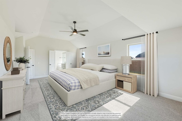 bedroom with ensuite bath, ceiling fan, carpet floors, and lofted ceiling