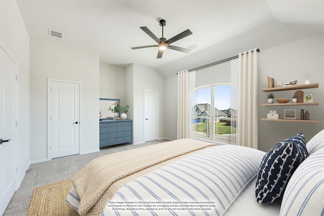 carpeted bedroom with ceiling fan and lofted ceiling