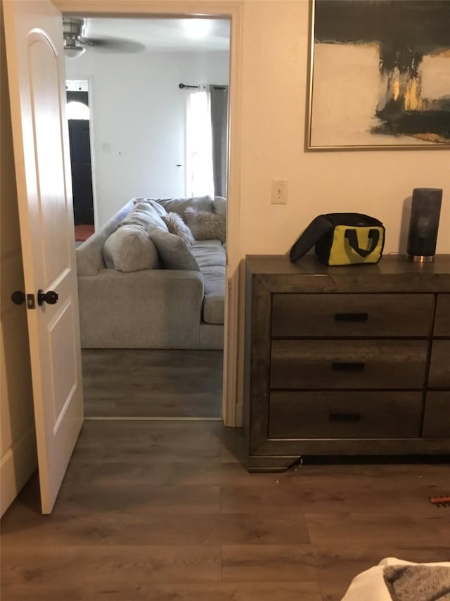 interior space with ceiling fan and dark wood-type flooring